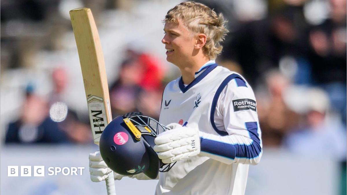 Will Luxton raises his bat after reaching a century for Yorkshire